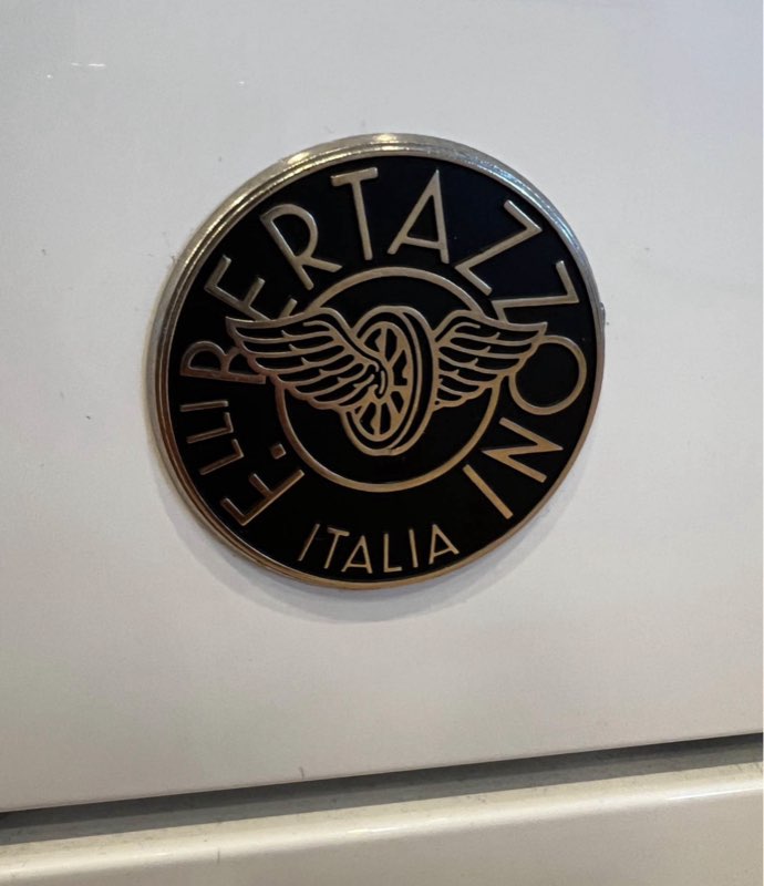 Close-up of the Bertazzoni oven door emblem on a panel-ready range serviced in Rancho Santa Fe