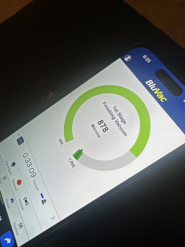 Digital micron gauge reading during the vacuum pull-down on the GE Profile refrigerator's sealed system